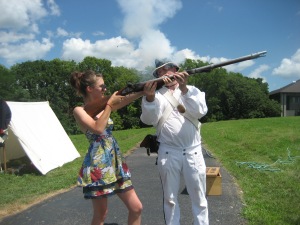 Shooting a musket at the Lewis & Clark Museum on the banks of Missouri in Nebraska.